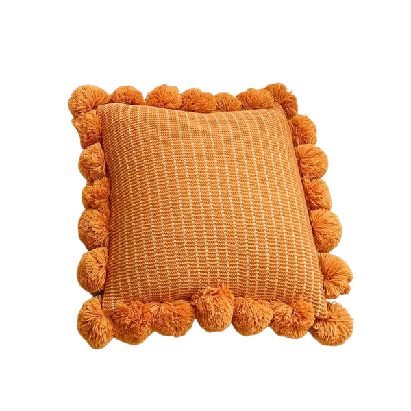 Coussin bohème orange avec pompons